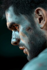 Obraz premium Intense Profile of a Battle-Worn Warrior with Striking Eye and Gritty Texture on Skin