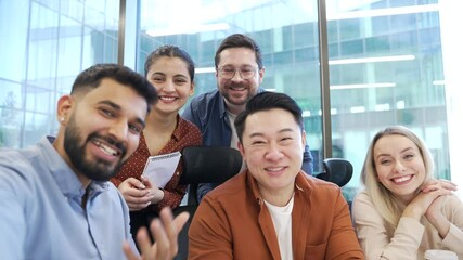 POV Group of happy business people talking on video call using phone sitting at workplace in modern business office. Joyful smiling colleagues communicates remotely looking at camera. Online chat - Powered by Adobe