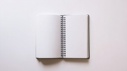 Realistic mockup of an open white spiral notebook with empty interior pages, displayed on a pristine white background for design presentations.