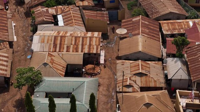 Aerial shot of houses in Moshi, Tanzania with rusted metal roofs