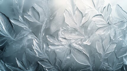 Intricate frost patterns resemble leaves on a glass surface