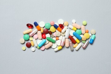 Various pills on gray background