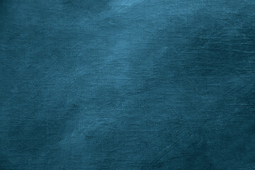 weathered blue background hand painted with white acrylic oil paint on canvas. White washed paint textured abstract cracked backdrop with brush strokes in grey and dark white shades.