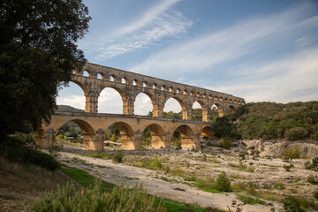 Pont du gard roman aqueduct in occitanie, france with river and trees