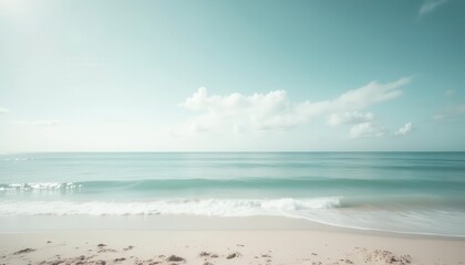 Fototapeta premium Soft Focus Beach Scene, Sunny Day, Calm Waves, Coastal Relaxation