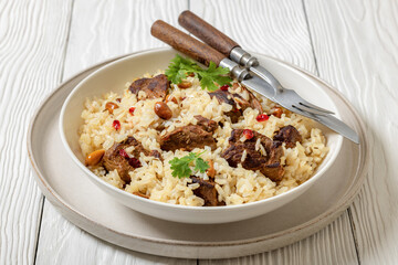 beef and rice in white bowl, top view