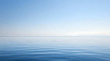 Obraz premium Serene Seascape Under a Pale Blue Sky