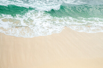 Peaceful Summer Seascape Featuring Blue Waters and Gentle Waves Rolling onto the Beach.