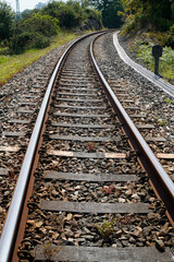 Fototapeta premium Life goes by on dark train tracks