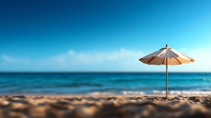 Silhouette of Parasol on Sandy Beach with Clear Blue Sky and Ocean Horizon