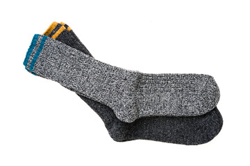 Top view of grey woolen winter socks on white background