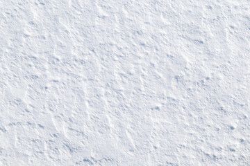 Close-up of fresh and bright snowy land in the winter on a sunny day, viewed from above. Abstract full frame textured background with copy space. Top view. Good for wintry backdrop.