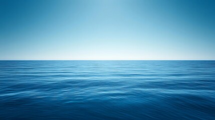 Obraz premium Tranquil Ocean Scene Under a Clear Blue Sky