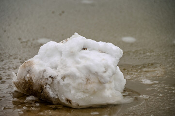 Snow rock on a lake