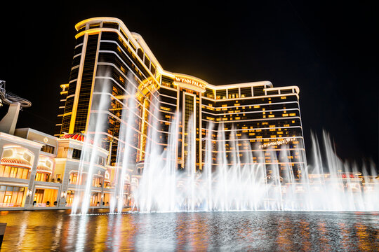 Macau- September 23, 2019: Beautiful night view of Wynn Palace Performance Lake displays a water, music, and light show, is a hotel casino resort on the Cotai Strip in Macau, China.