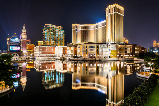 Macau- September 23, 2019: Night view of the Venetian and other luxury hotel and casino resorts in Cotai Strip of Macau, China, with beautiful reflections of the majestic buildings in the water.