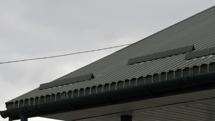 Naklejka premium metal profile. roofing. replacement of coating for the house. roof repair