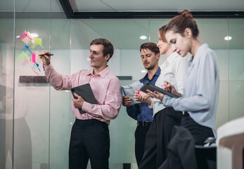 Businesspeople Using Sticky Notes for Strategic Planning