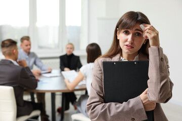 Glossophobia. Woman with paper tissue and clipboard feeling embarrassed during business meeting in...