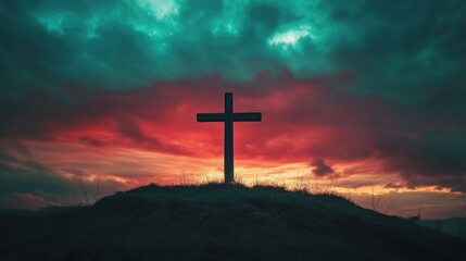 Obraz premium A rustic wooden cross standing alone on a hilltop against a dramatic twilight sky.