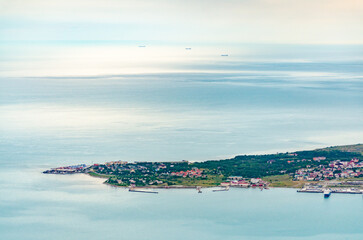 Aerial perspective captures Gelendzhik peninsula surrounded by calm waters, showcasing lush...