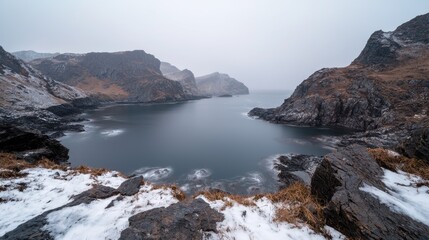 Fototapeta premium Winter Landscape Misty Fjord with Snow-Covered Peaks
