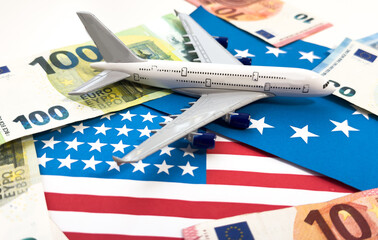  white airplane on dollar and euro in cash close-up. Financial concept. tourist concept.