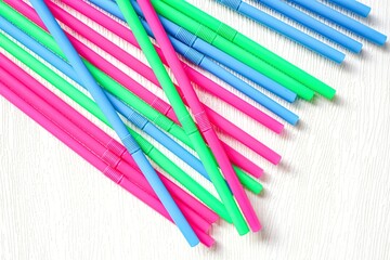Colorful drinking straws on white background