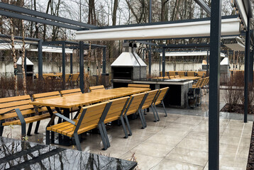 Beautiful backyard with barbeque area and dining table