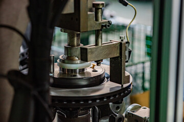 Factory automation production line. Automotive parts production line. Workers are producing car brake discs and various components in the machining workshop. Inside the automotive intelligent factory