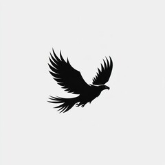 Fototapeta premium Silhouette of a soaring eagle against a plain background. Possible use Stock photo for nature, wildlife, or freedom concepts