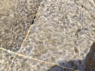 Abstract Water Flowing Over Rocks Creating a Textured Background