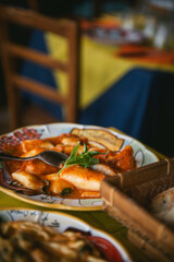 Spinach stuffed cannelloni pasta with tomato sauce at an italian restaurant