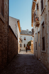 Exploring European charm, on a bright sunny day. Beautiful, ancient architecture, warm neutral colours.