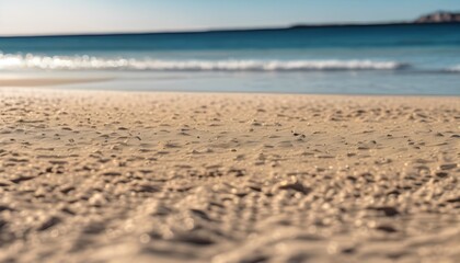 Obraz premium yellow warm sand, blue see and clear sky. summer minimalistic landscape background. wallpaper