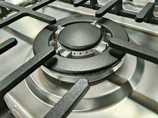 Close Up Of A Silver Metal Stove Burner On A Stainless Steel Cooktop Surface