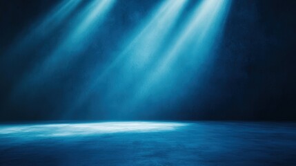 Fototapeta premium A dark stage illuminated by blue light beams, creating a dramatic and ethereal atmosphere suitable for performances or events.