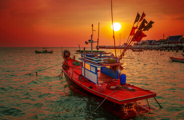 Beautiful old small fishing boat at sunset, Chon Buri, Thailand