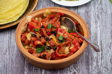 Vegan stew made with cabbage, pepper and seitan  as meat alternative