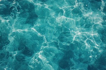 Fototapeta premium Turquoise water surface texture, natural light reflections