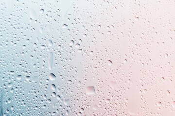 Water droplets on glass with soft pastel gradient background, refreshing abstract texture