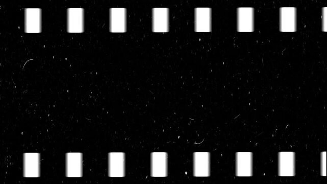Film frame stock videos dust and grain on the old damaged film surf white dust and scratches on a black background. The texture of dirt on the glass 4k free