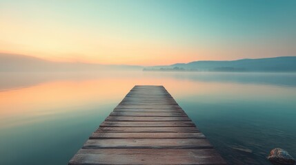 Fototapeta premium Tranquil Sunrise over Misty Lake with Wooden Dock