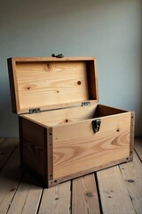 A rustic, light-colored wooden chest with a hinged lid and dark metal accents rests open on a light wood surface, ready to hold treasured memories or carefully guarded secrets.