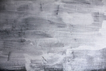 Obraz premium white cement wall with faded abstract pattern