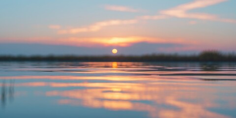 Obraz premium Serene Sunset Reflection on Water Surface