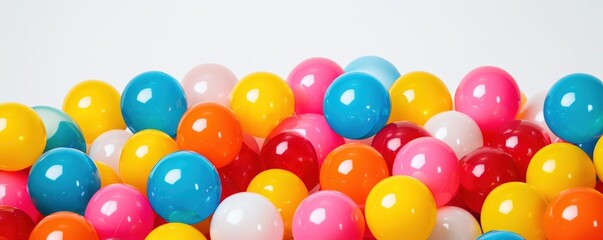 A vibrant assortment of colorful plastic balls in various sizes, creating a playful and lively scene.