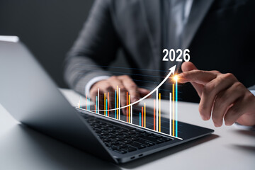 Growth Target 2026, Businessman Analyzes Arrow Chart Increasing Business Growth, Vision for 2026, Opportunity and Strategy Planning, Revenue, Profit, Global Economic Outlook.