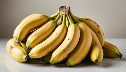 A bundle of ripe bananas on a clean, neutral background, with perfect lighting to highlight their golden yellow color and natural curves