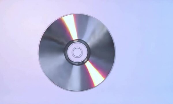 Shiny compact discs and DVDs, stacked as blank media for digital data storage